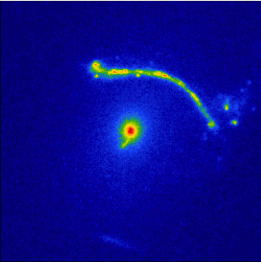 Abell 1201 with a bright arc of gravitationally lensed light.